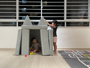 children playing with a playhouse made with Playand modular foam blocks